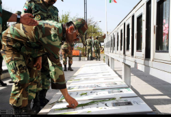 گل افشانی و غبارروبی مزار شهدای قزوین با حضور نیروهای ارتش